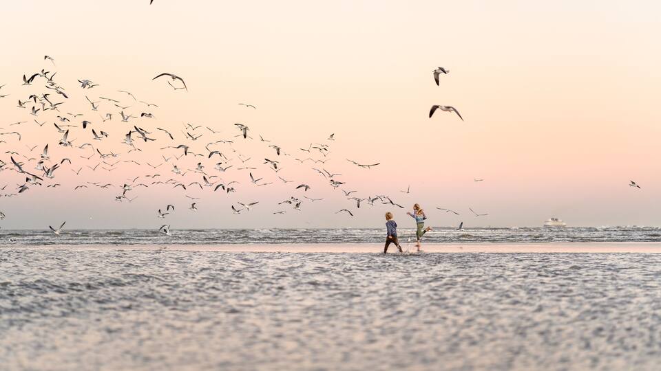 Two children on Texas beach at dusk