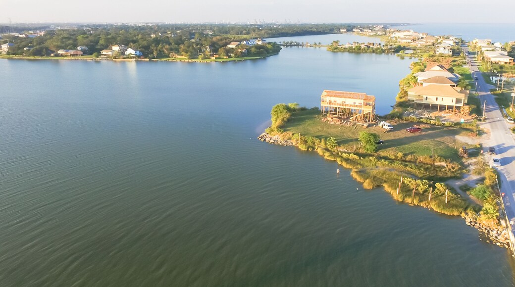 Panorama aerial view of Seabrook city near Texas Gulf Coast and Clear Lake. Waterfront harbor town with pier. Wooden vacation house under construction. Real estate and beach travel background
