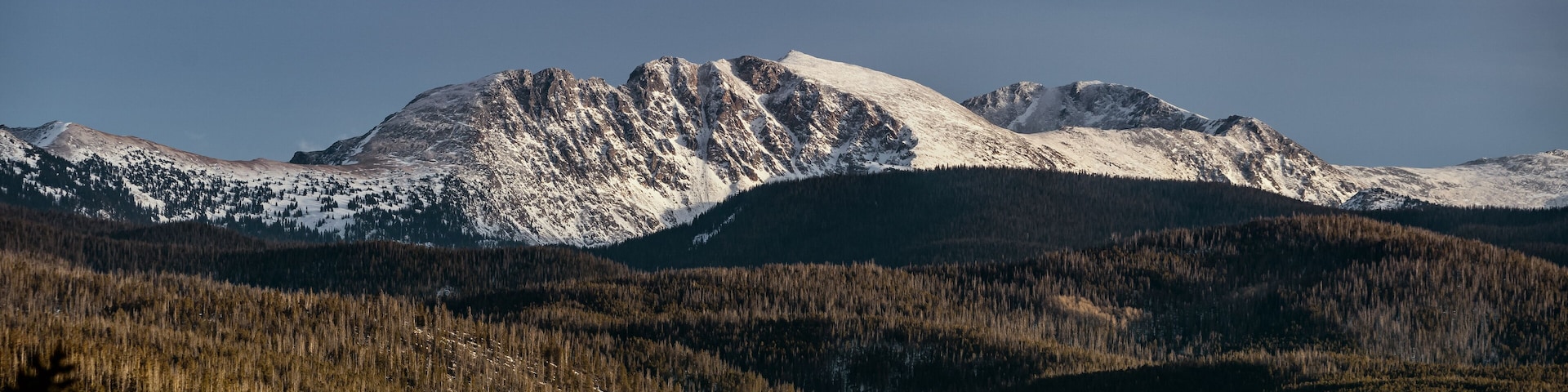 View of white peaks of the Rock Mountains in Colorado near Grand Lake in the USA.
