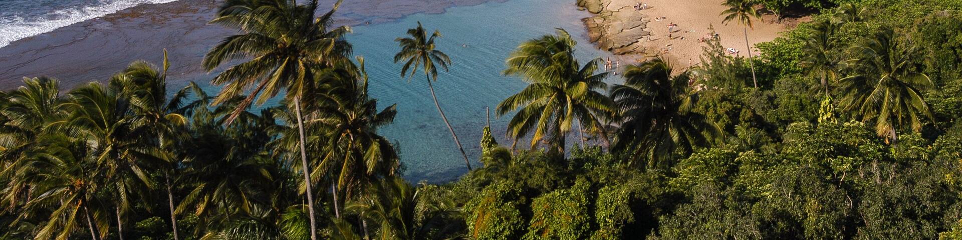 Golden sand Kee Beach and aquamarine colored lagoon from the Kalalau Trail in Haena State Park (end of the road) on Kauai, Hawaii, USA