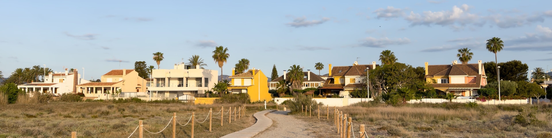 House on coastline. Real Estate Penthouse apartments on Coast. Resort housing. Suburb house at sea. Villa at Spain seaside. Home in residential area at shore. Vacation accommodation home on Beachfront