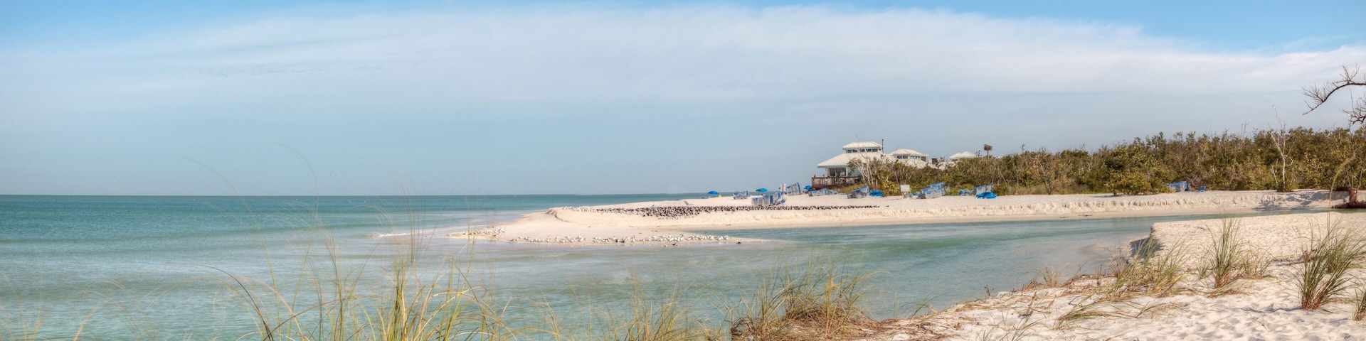 White sand beach and aqua blue water of Clam Pass in Naples, Florida