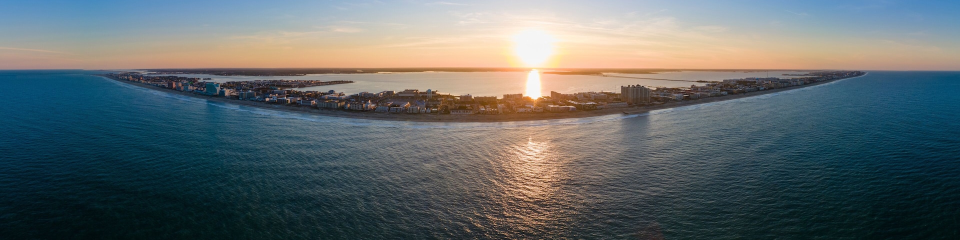 Panoramic aerial view of the beach at sunset in Ocean City, Maryland, United States.