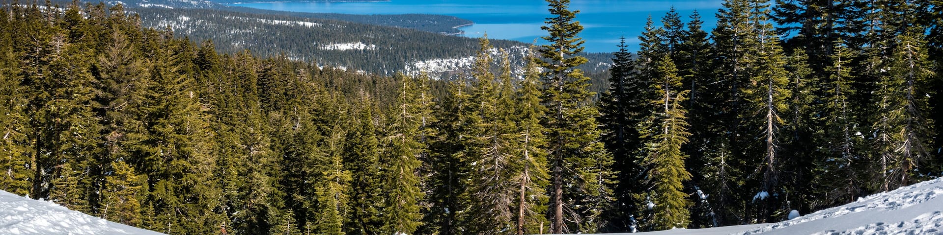 Panoramic view of the Sierra Nevada Mountains of California with Lake Tahoe in the background, from the (Olympic) Valley Ski Resort, between Truckee and Tahoe City.