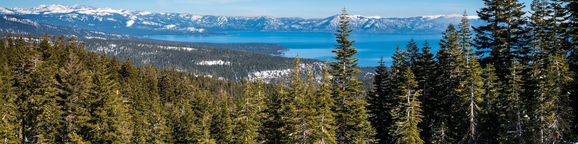 Panoramic view of the Sierra Nevada Mountains of California with Lake Tahoe in the background, from the (Olympic) Valley Ski Resort, between Truckee and Tahoe City.