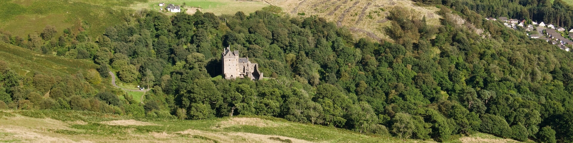 Scenic view of Castle Campbell from the top of a hill