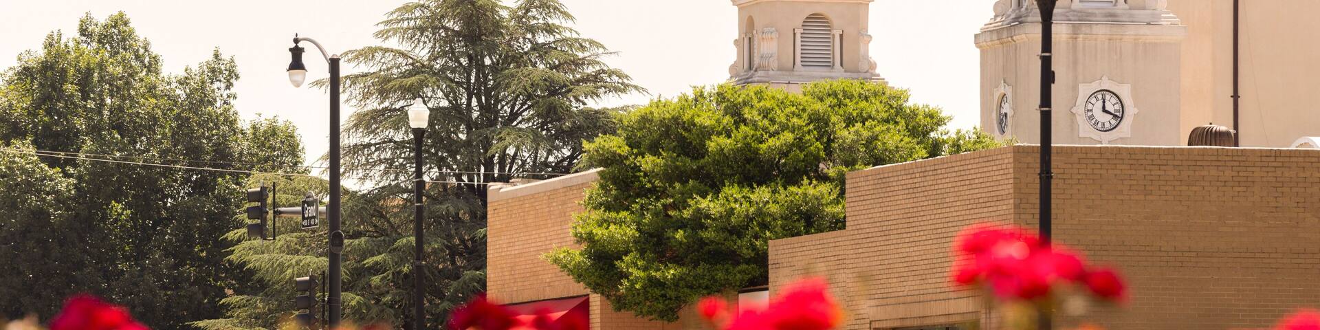 Ponca City, Oklahoma, USA - June 24, 2023: Morning sun shines on the historic downtown City Hall.