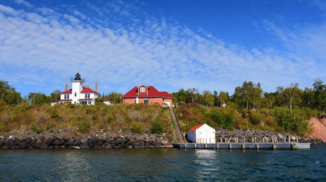 the wooden raspberry island light station, boathouse, dock, and tramway, on the apostle island of raspberry island in lake superior off the wisconsin coast on a sunny fall day