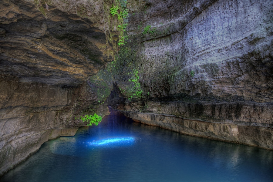 Roaring River Spring Roaring Rivers State Park Cassville Missouri Emerging from the base of a limestone bluff, and an average daily flow of 26 million gallons.