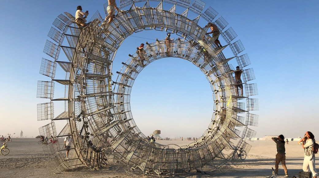 Where can you climb a giant hoop made of shopping carts? Burning Man Arts Festival! Think about going next year. Art: “Perpetual Consumption” by Clayton Blakeart.