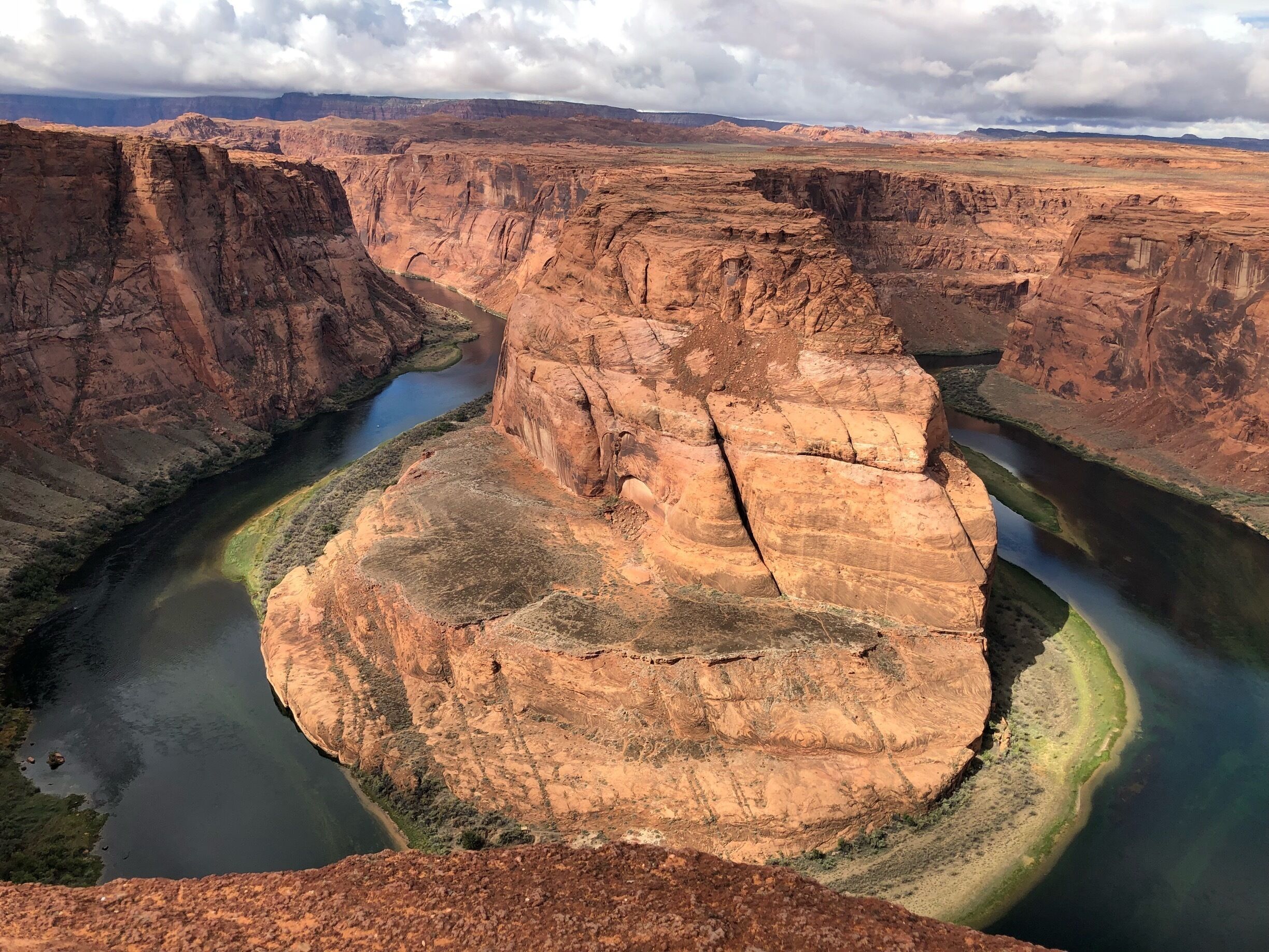 A canyon with a river winding through it.