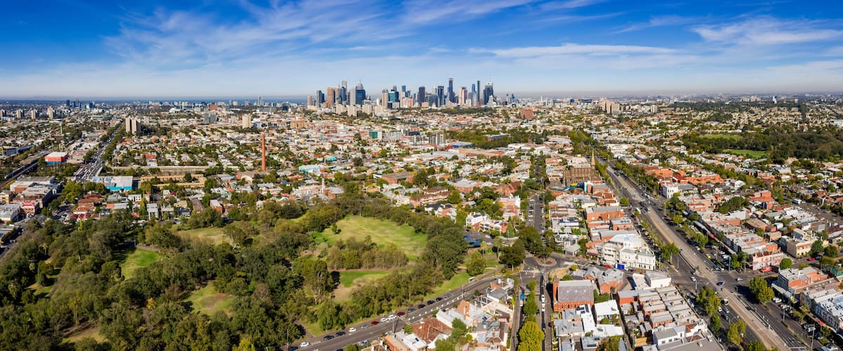 Aerial view of the suburbs of Clifton Hill and Fitzroy, with the city of Melbourne in the background