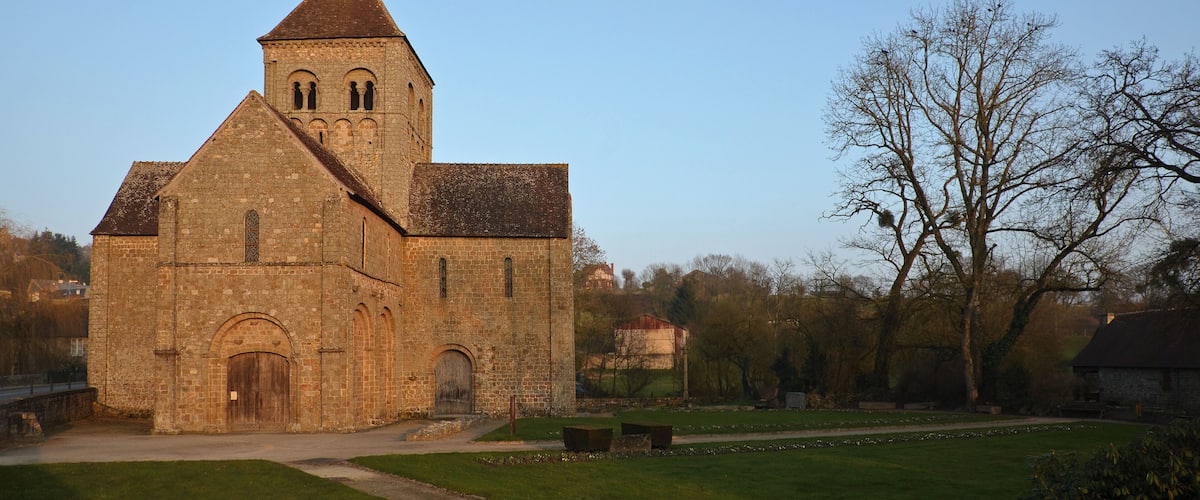 A historic church with a tall tower and arched windows.