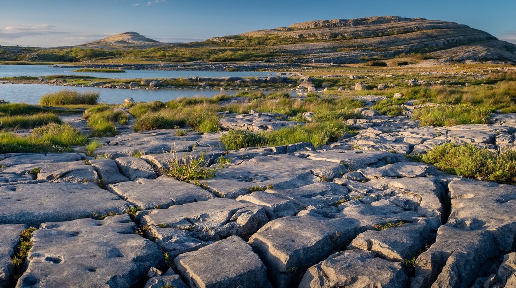 A panorama of the stunning and mars like landscape that is The Burren National Park, County Clare, Ireland at dusk.