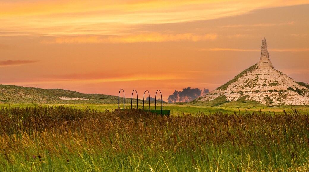 chimney rock national historic site. It is a prominent geological rock formation in western Nebraska, rising nearly 300 feet above the surrounding North Platte River valley