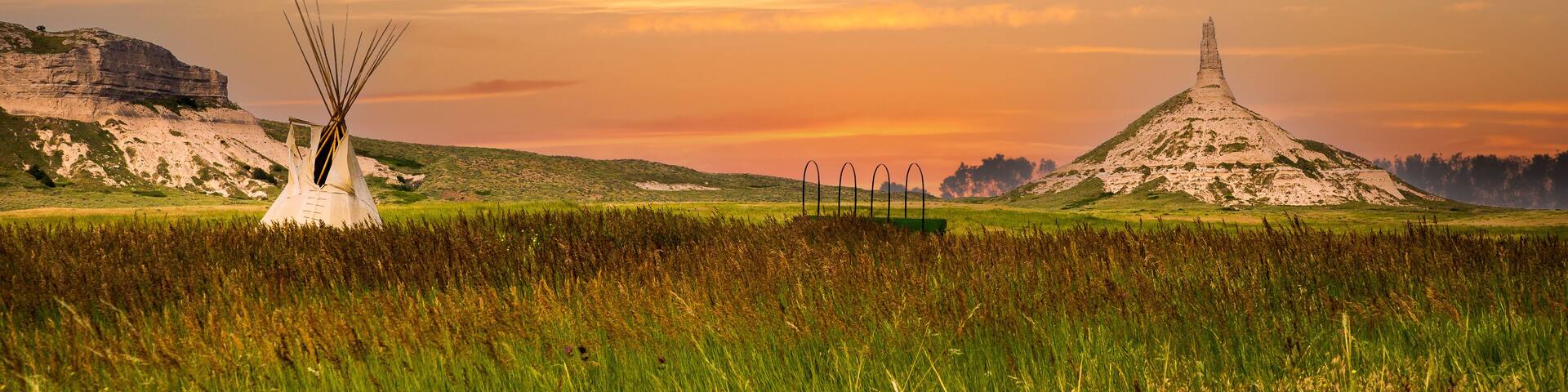 chimney rock national historic site. It is a prominent geological rock formation in western Nebraska, rising nearly 300 feet above the surrounding North Platte River valley