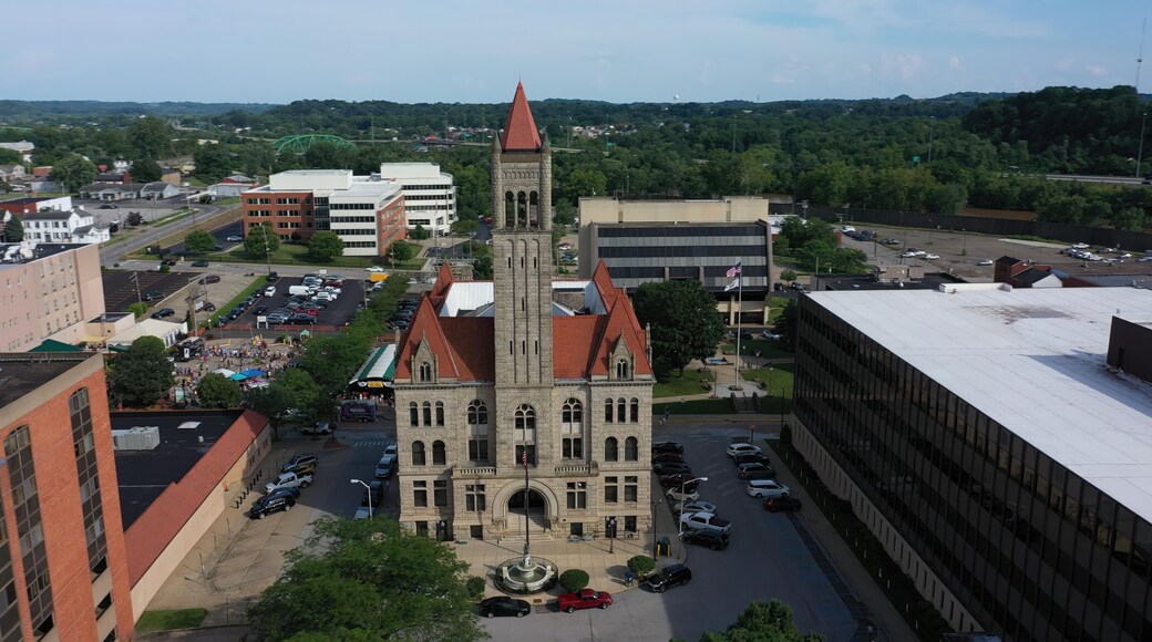 This aerial perspective highlights the historic courthouse in downtown Parkersburg, West Virginia, framed by lush hills and urban development.