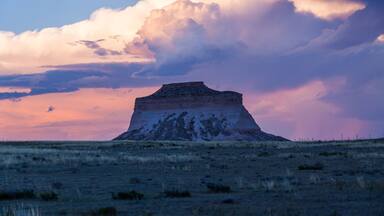 Storm Clouds gather over Pawnee Buttes in the Pawnee National Grassland on the Great Plains of northeastern Colorado at sunset in summer
