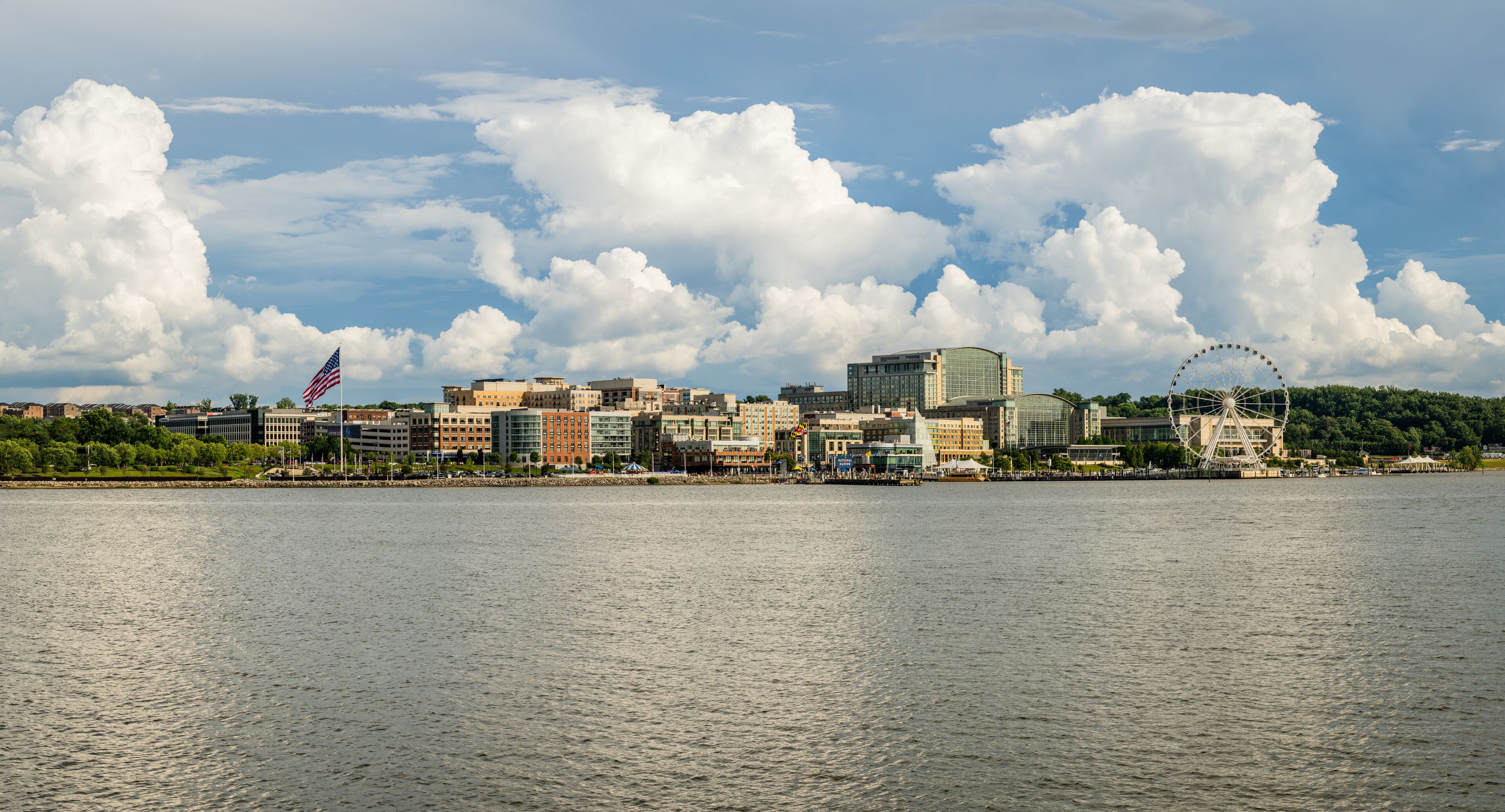 Dramatic summer clouds above panoramic skyline of National Harbor near Washington DC
