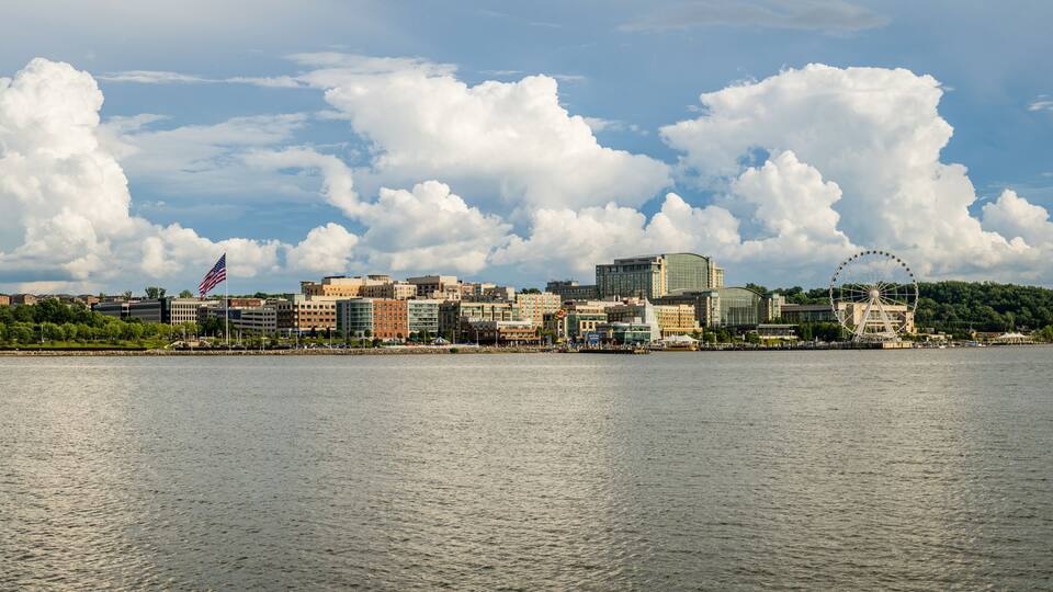 Dramatic summer clouds above panoramic skyline of National Harbor near Washington DC