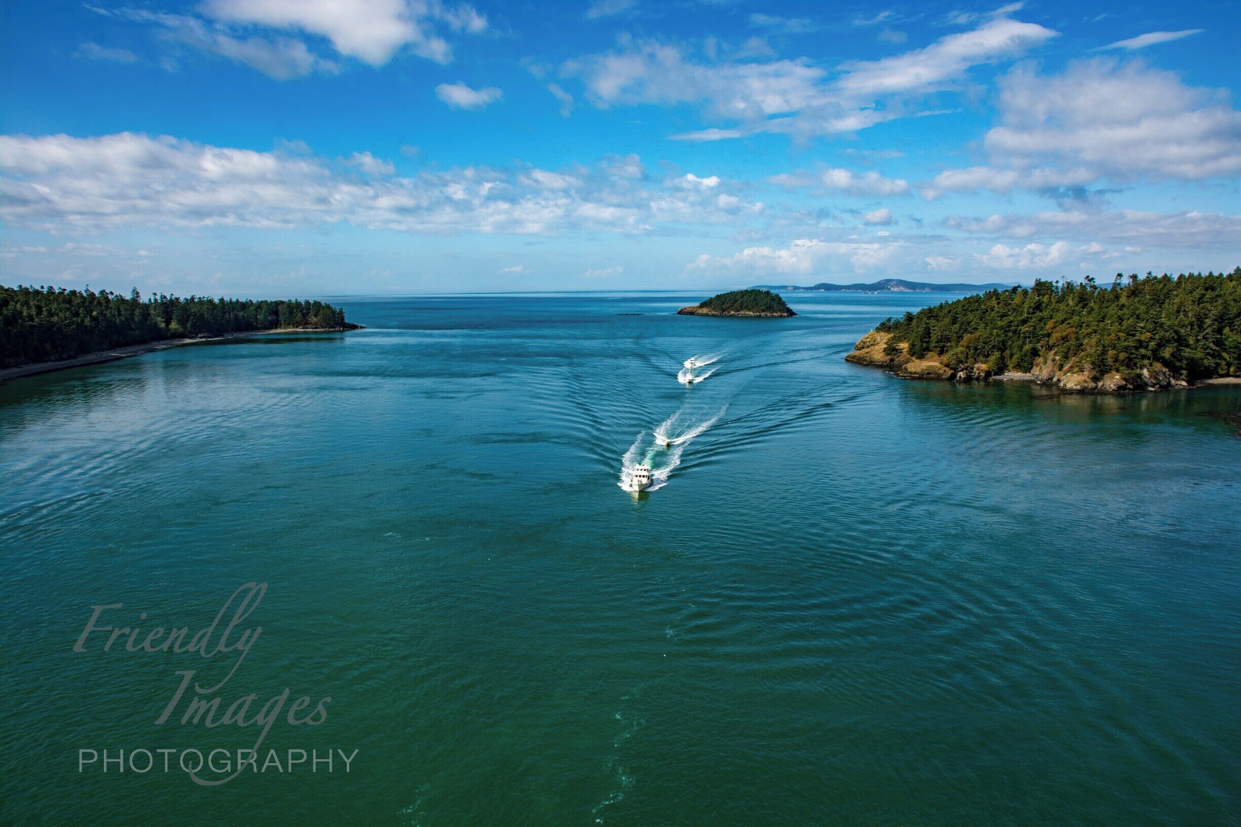 Another gorgeous day in Washington. Taken form the middle of Deception Pass Bridge. Of fishing boats returning to the harbor nearby. The perfect amount of clouds and clear water was gorgeous.
Friendlyimagesphotography.com
