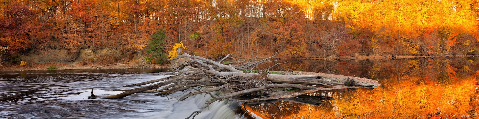 dam in the river in autumn