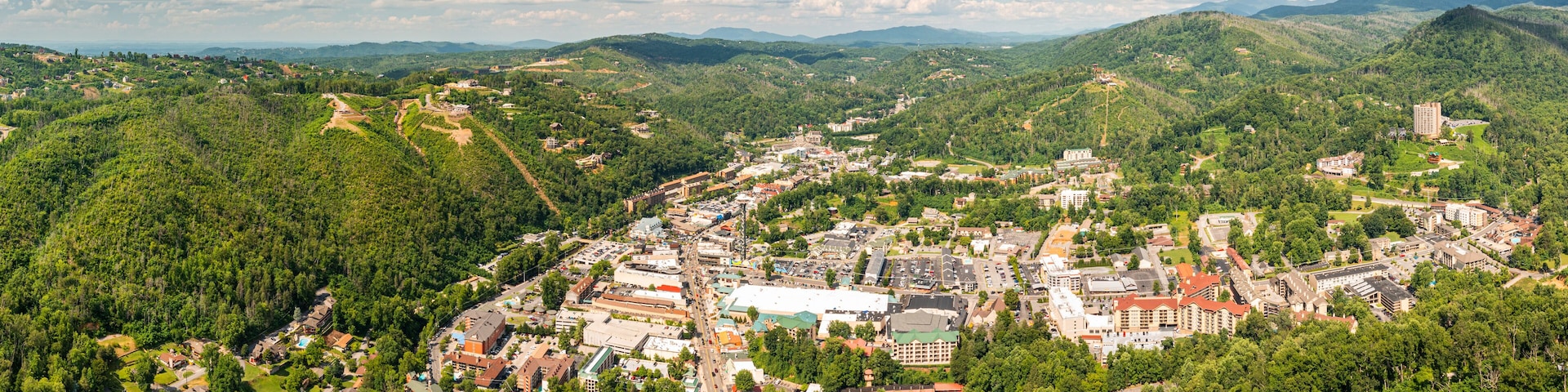 Aerial view of Gatlinburg above US-441. Gatlinburg is a popular mountain resort city in Sevier County, Tennessee, as it rests on the border of Great Smoky Mountains National Park.