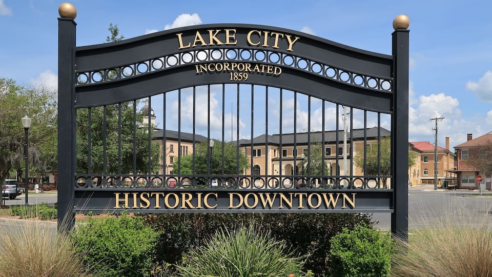 A historic downtown sign with 'Lake City Incorporated 1859' and 'Historic Downtown' written on it.