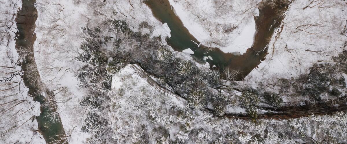 Aerial of Snow Covered Laurel Gorge with Winding Little Sandy River and Sandstone Cliffs Visible - Appalachian Mountains of Eastern Kentucky