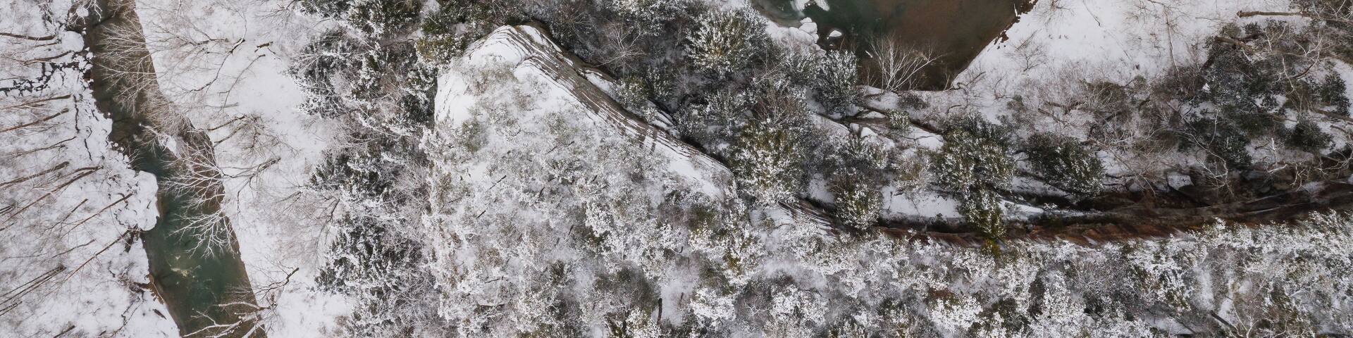 Aerial of Snow Covered Laurel Gorge with Winding Little Sandy River and Sandstone Cliffs Visible - Appalachian Mountains of Eastern Kentucky
