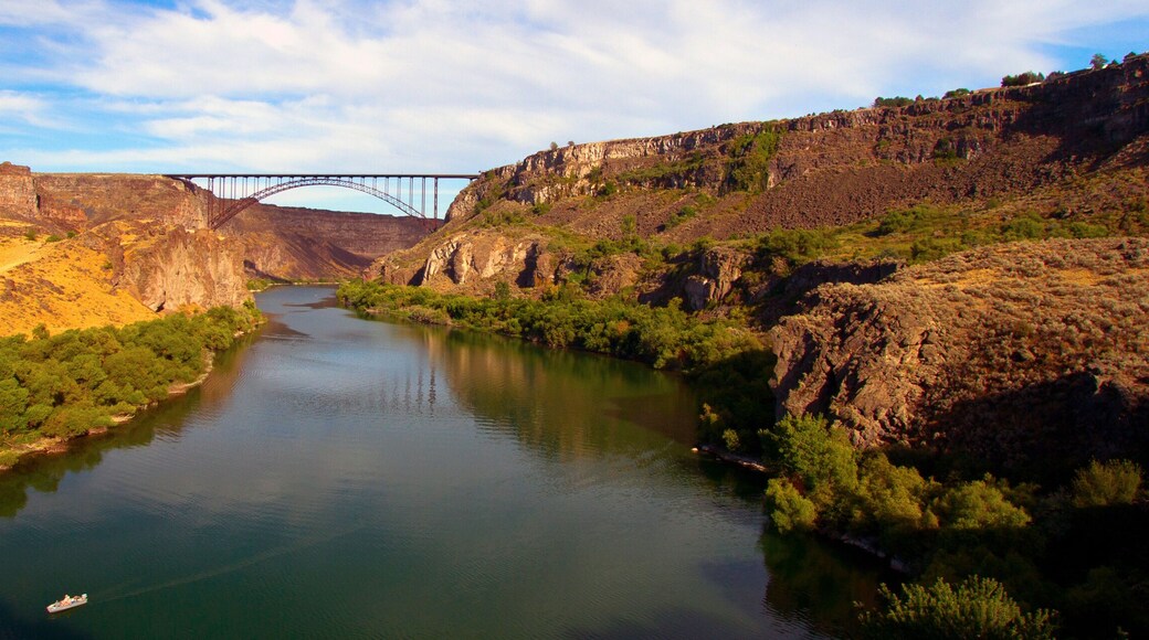 Wide panorama of golden evening light on I. B. Perrine Bridge and the Snake River at Twin Falls, Idaho