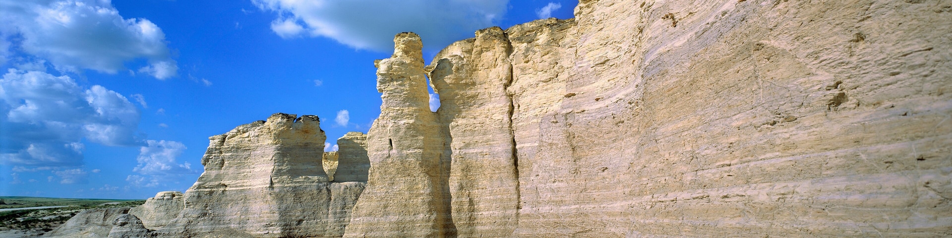 USA, Kansas, Logan County, Monument Rocks. The striated limestone of Monument Rocks form a thick wall, in Logan County, Kansas.