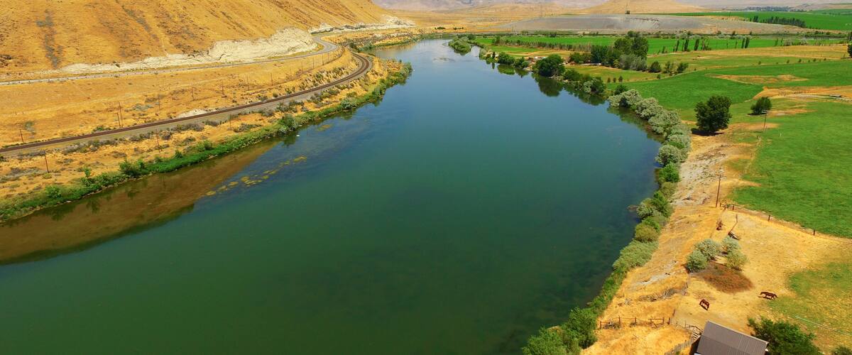 The Snake River Flows By Bluffs at Glenns Ferry Idaho