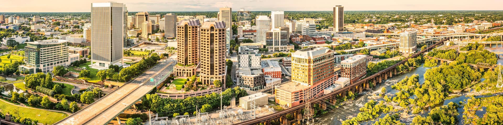 Aerial panorama of Richmond, Virginia, at sunset. Richmond is the capital city of the Commonwealth of Virginia. Manchester Bridge spans James River