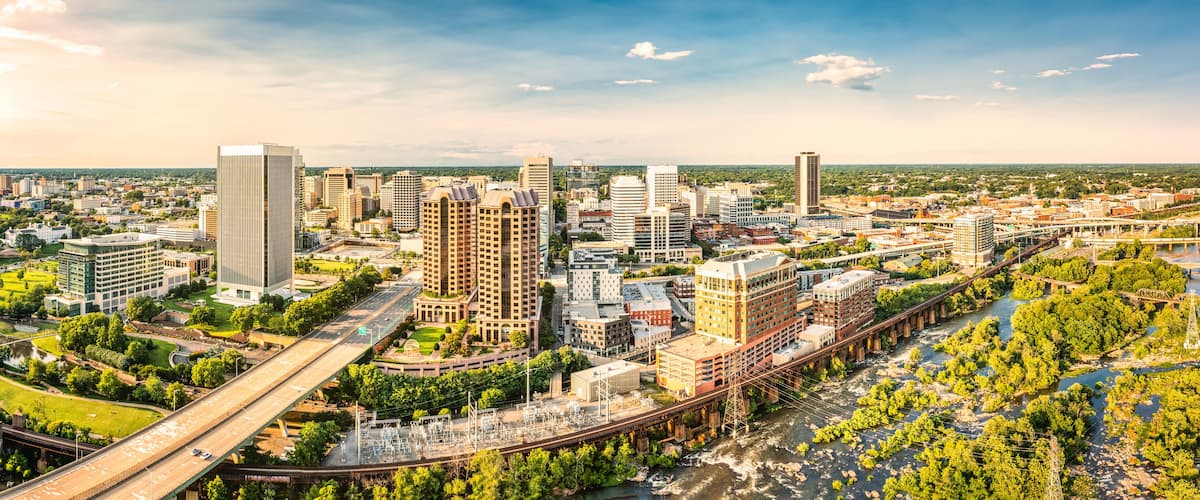 A cityscape with a river, bridges, and various buildings.