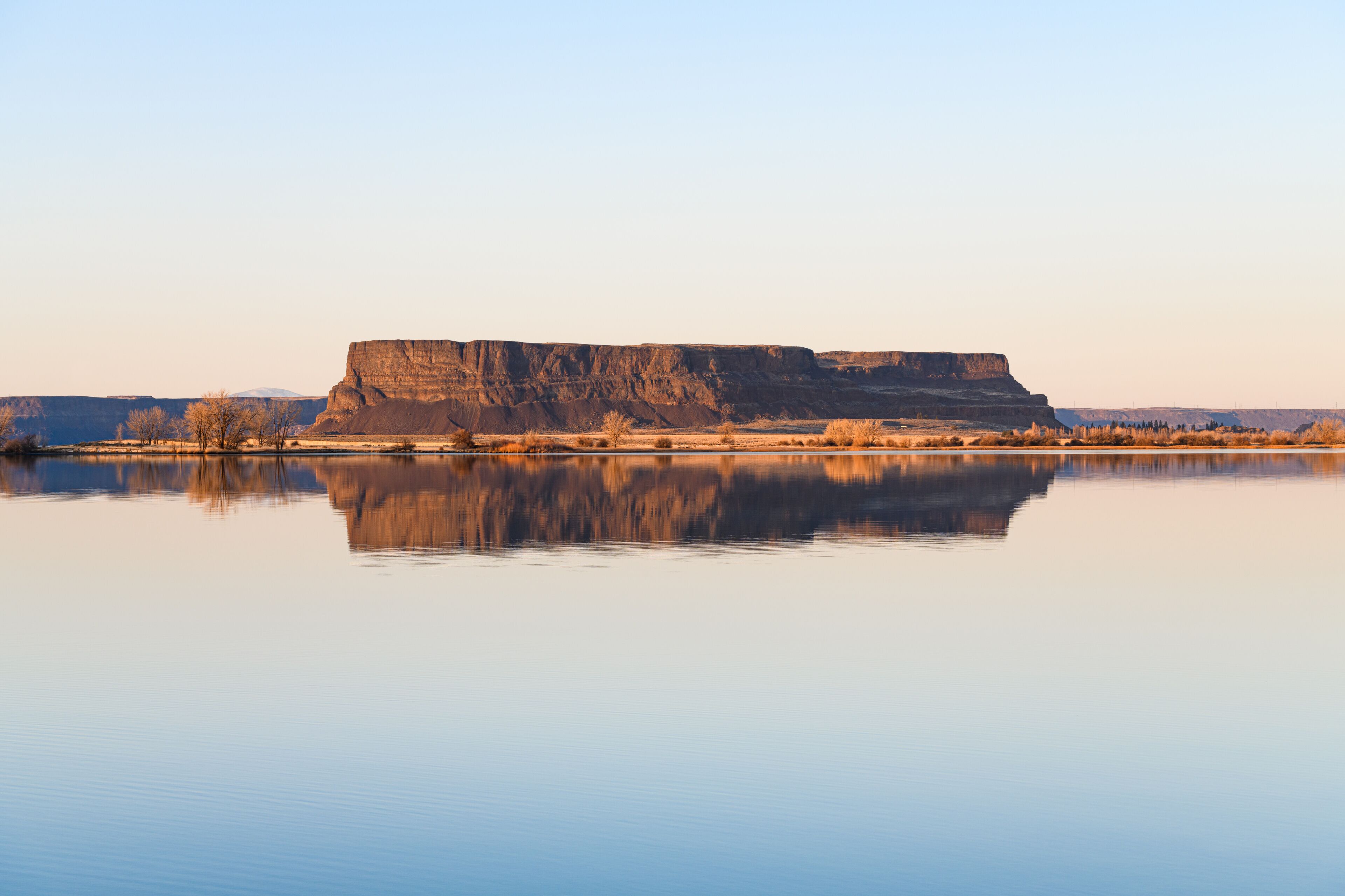 Steamboat Rock reflecting in a perfectly smooth Banks Lake in Central Washington State