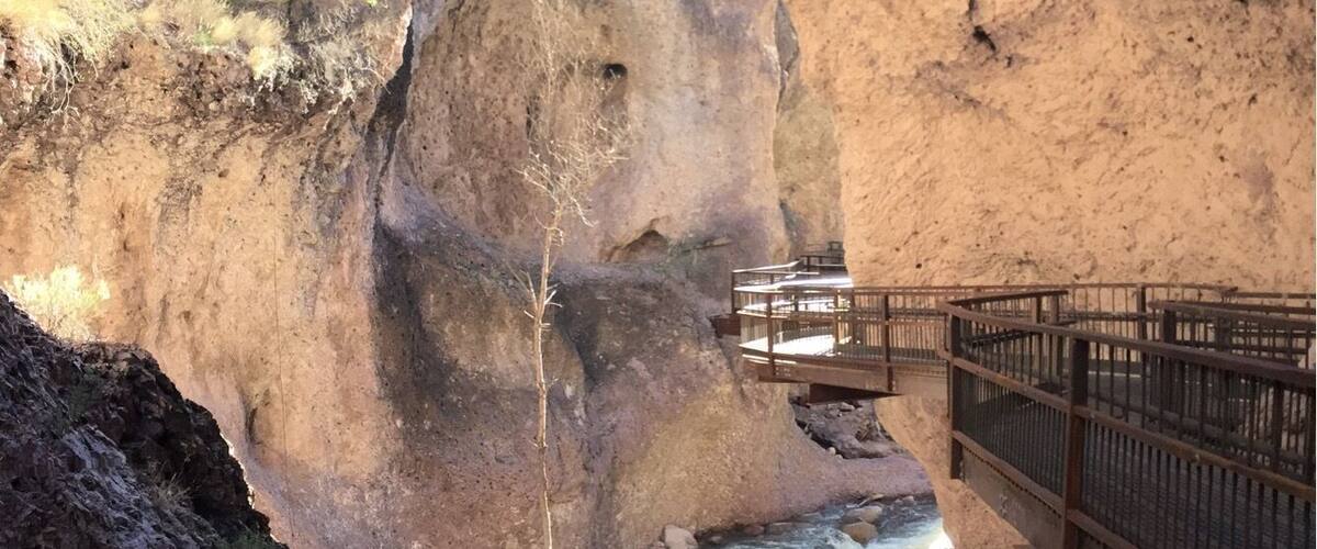 The Catwalk, created for recreation following the closing of ore mines in the canyon, invites visitors to cling to canyon walls as they travel about one mile upstream. Footings are moored deep into the rock faces, placed by early miners who once populated a small town at the mouth of the narrow passage.