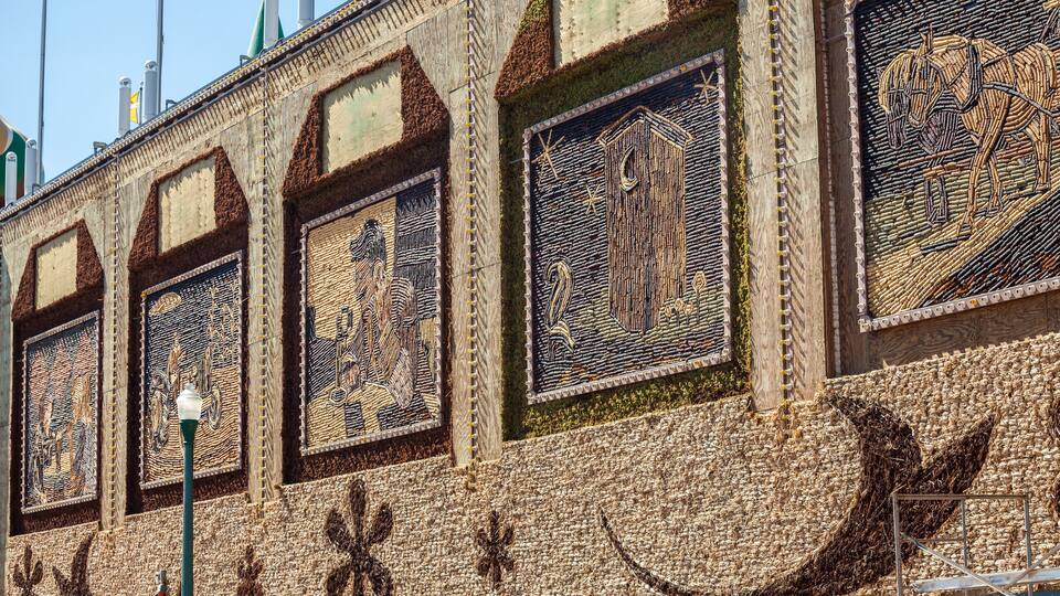A building with intricate mosaic artwork on its facade.