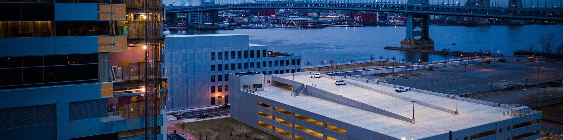 A bridge, a parking garage, and a river.