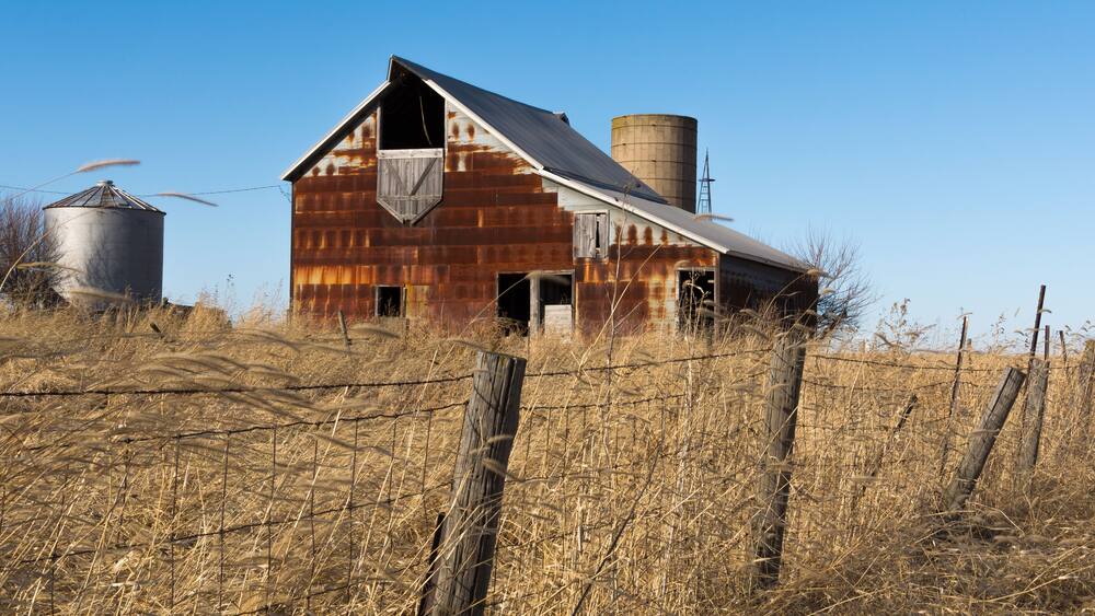 Old rustic barn in the rural Midwest on a windy Winter's day. Marshall County, Illinois, USA