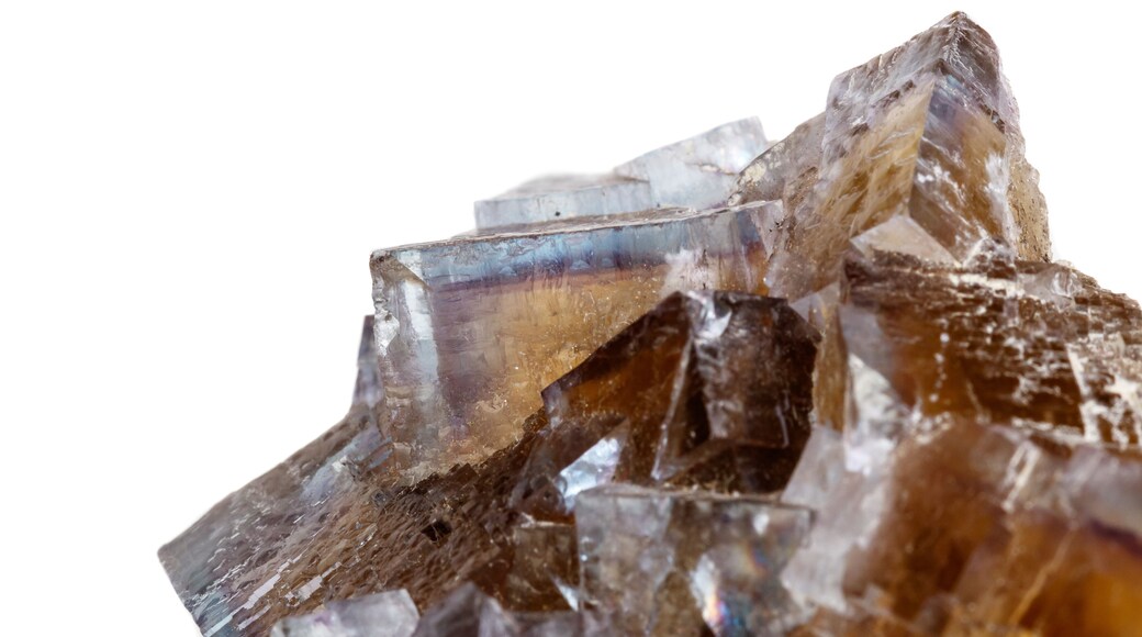 Macro mineral stone yellow Fluorite on a white background