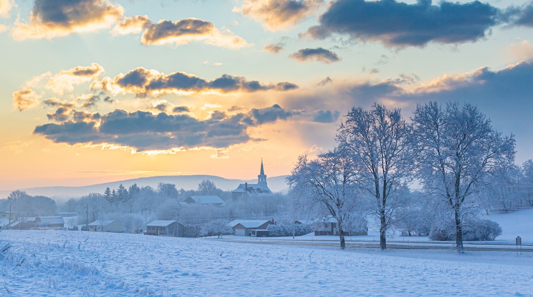 Snowy Sunrise Over A Rural Church