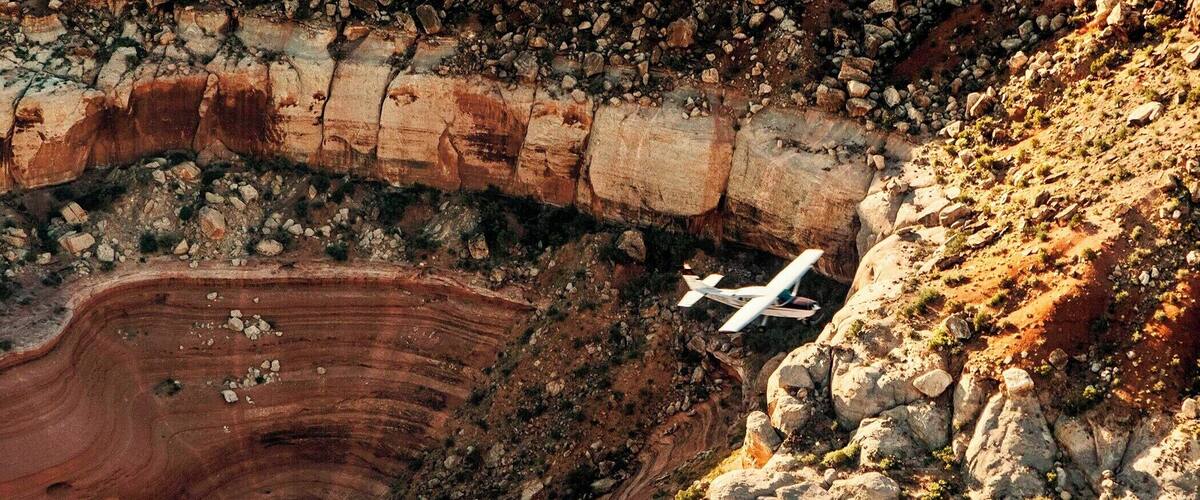 Taken while on a hot air balloon flight over the Moab/Canyonlands area. It was amazing when a plane flew below us.