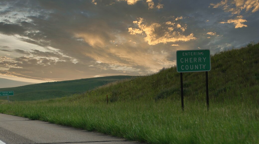Roadside sign entering Cherry County along Highway 183 in Nebraska, USA.