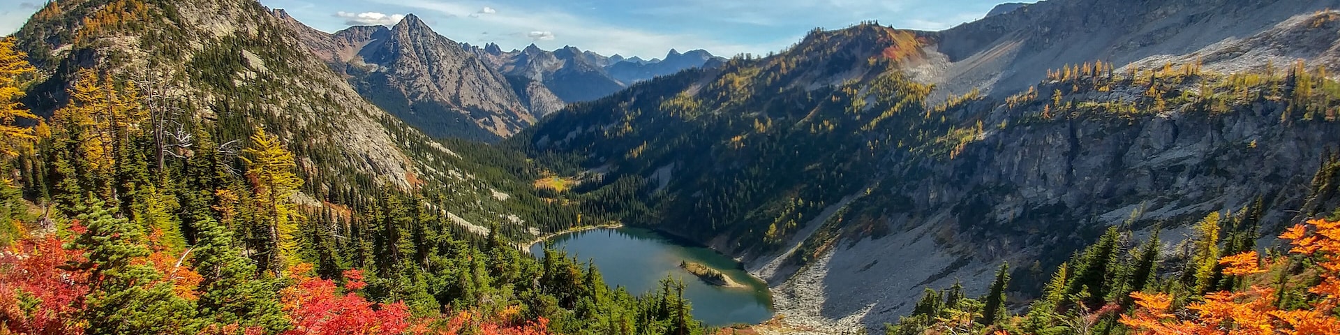 Brilliant reds, oranges, yellows, greens, and blues color the landscape in autumn near the backside of the Maple Pass Loop just outside of North Cascades National Park. Fall is an excellent time to go with near perfect temperatures and gorgeous scenery. This area is about 3 hours from Seattle.