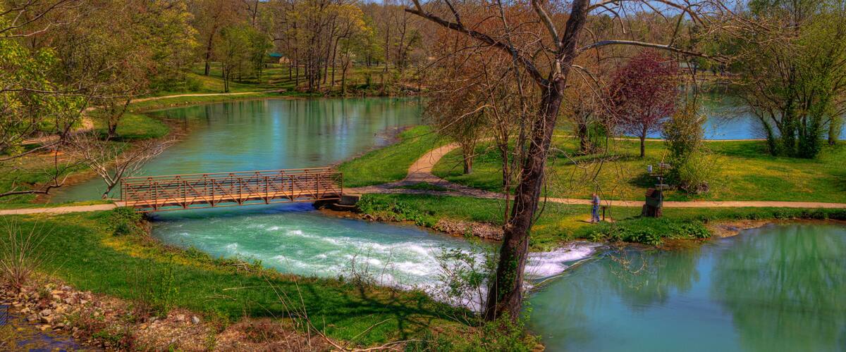 A View Mammoth Spring from Overlook Mammoth Spring State Park Mammoth Spring Arkansas With an average flow of nine million gallons of water per hour, One of the largest springs in the world.