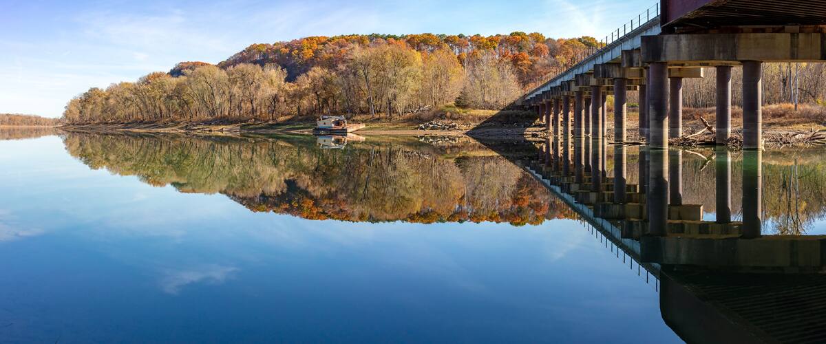 Scenic Autumn view of the Gasconade River railroad bridge at the riverfront park in Gasconade, Missouri