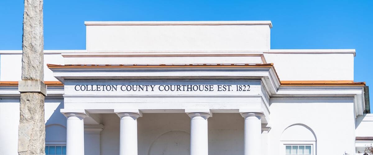 Walterboro, USA Colleton county courthouse clerk of court building sign at white architecture facade in South Carolina city