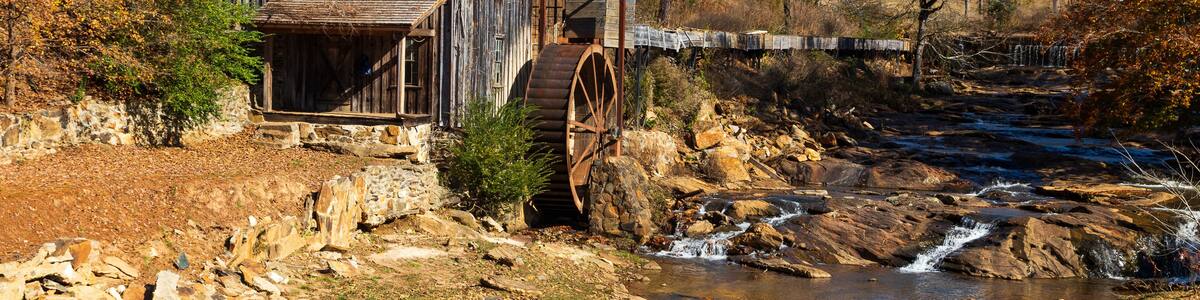 Historic Sixes Mill from the 1800s in Canton, Georgia, during autumn.