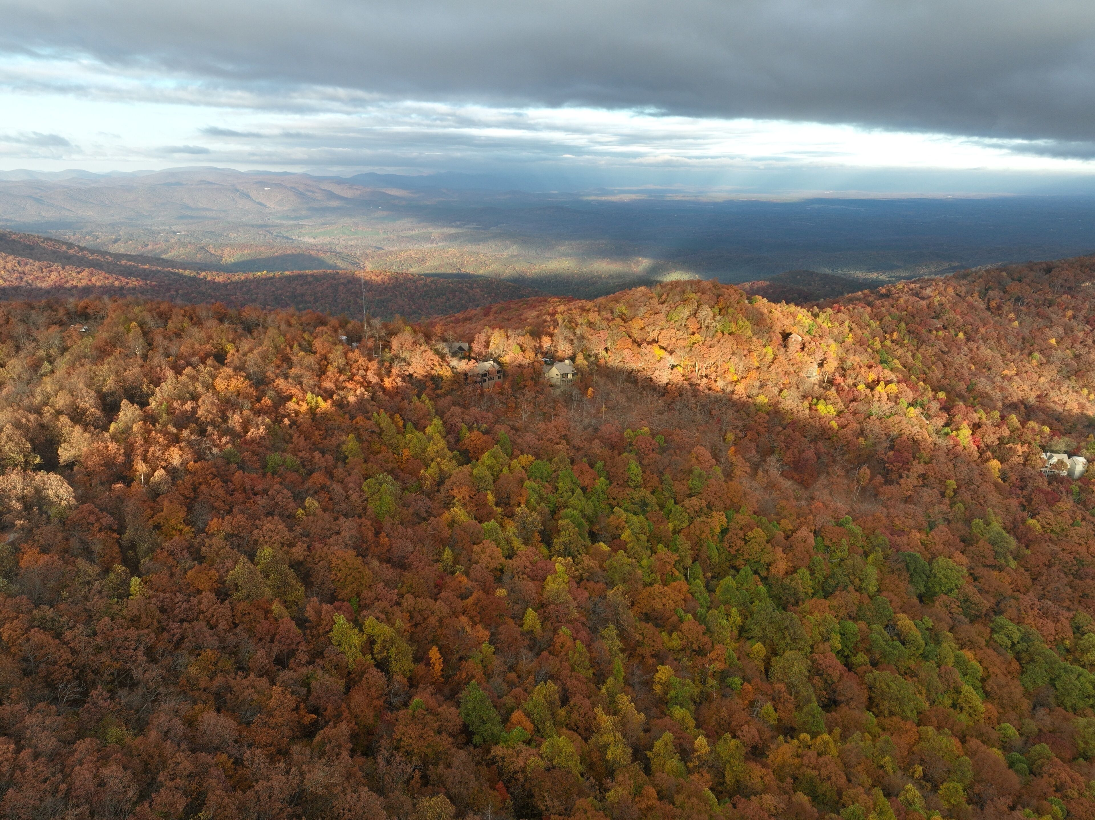 Aerial photo of Georgia Mountains 
homes during a beautiful fall sunset on Big Canoe